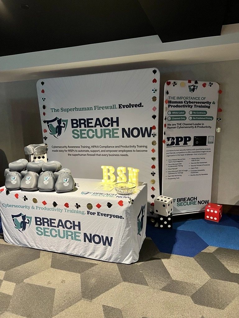 The Breach Secure Now booth at ScaleCon24 in Las Vegas: a table with lit BSN letters and oversized dice